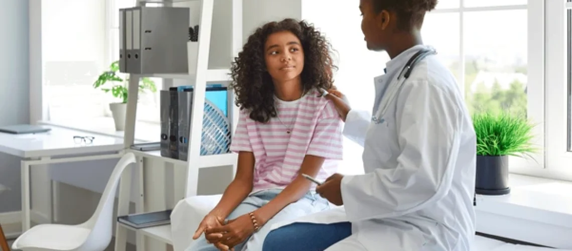 friendly-female-pediatrician-touches-shoulder-600nw-2238130967