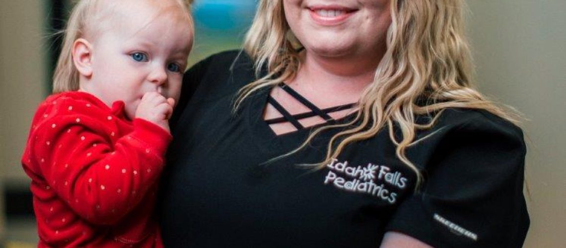 nurse-holding-child
